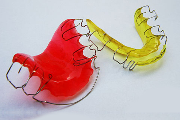 A close-up of a pair of retainers, showcasing their effectiveness in teeth straightening.