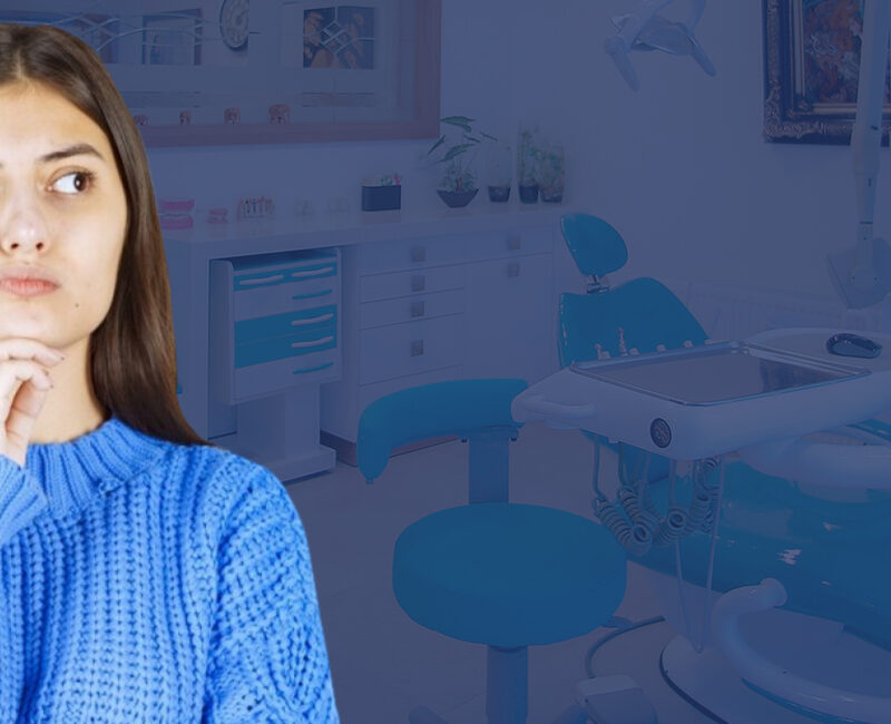 A woman is standing in front of a dental office, considering wearing teeth straighteners and wondering how they work.